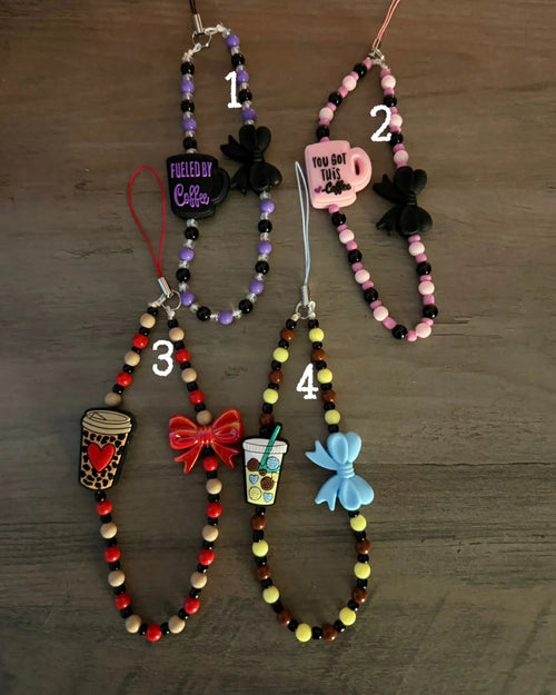 Colorful coffee-themed phone charms, featuring coffee cups, bows, and motivational phrases, all strung with vibrant beads.